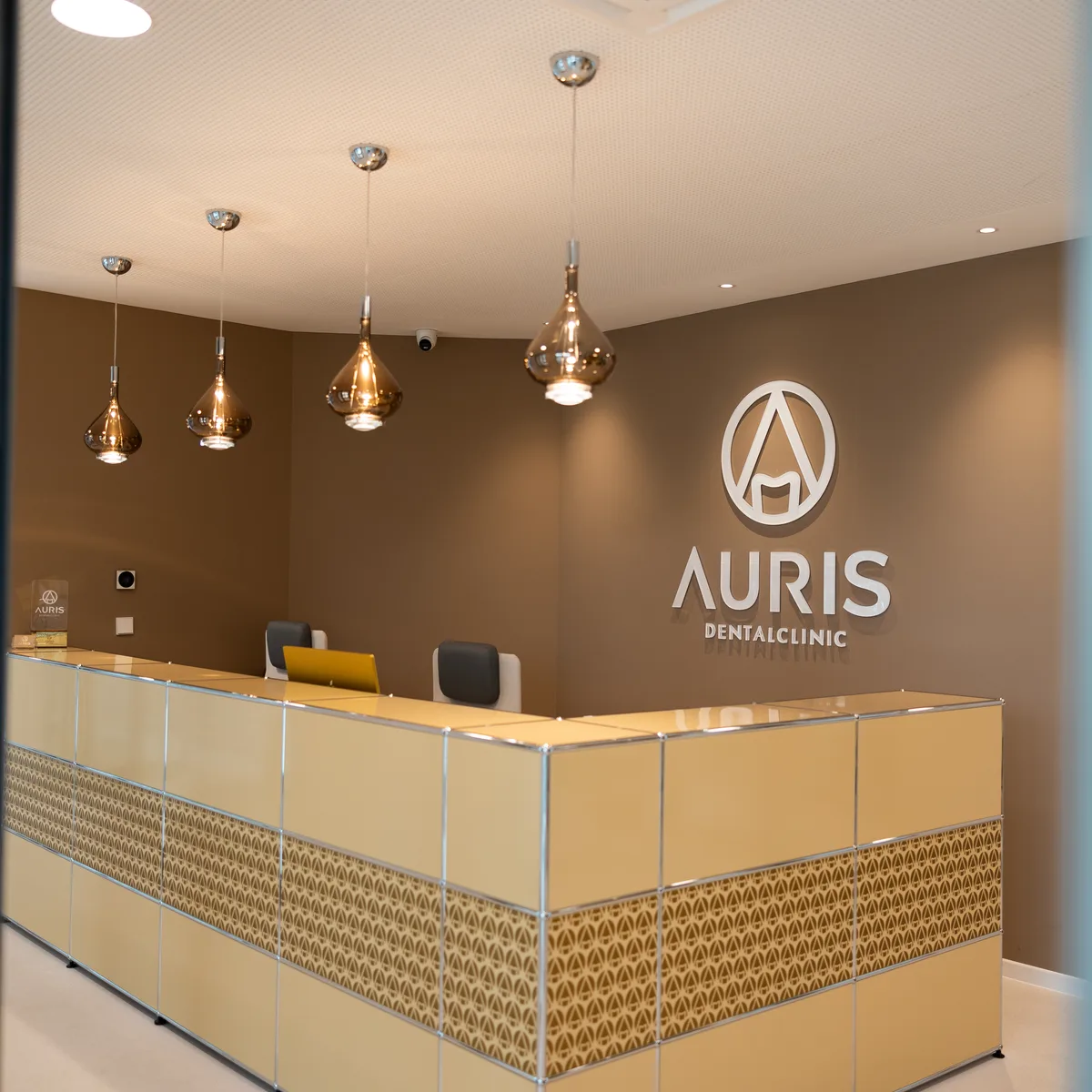 Auris Dental reception in Pristina with the clinic logo